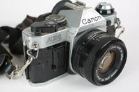 Vintage Canon AE-1 Program 35mm Film Camera Package with 50mm F/1.8 Canon Lens
