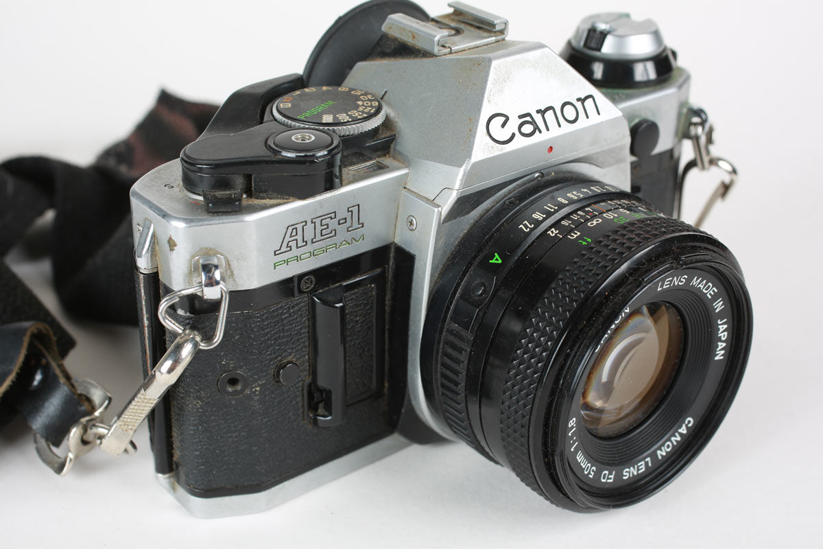 Vintage Canon AE-1 Program 35mm Film Camera Package with 50mm F/1.8 Canon Lens