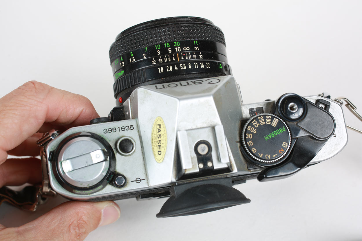 Vintage Canon AE-1 Program 35mm Film Camera Package with 50mm F/1.8 Canon Lens