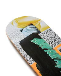 Close-up of a skateboard deck with a colorful design and text on a white background