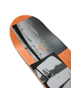 Skateboard deck with black and orange design on a white background