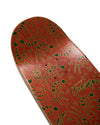 Skateboard deck with red and green pattern on a white background