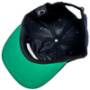 Black and green cap with a visible brand logo on a light background